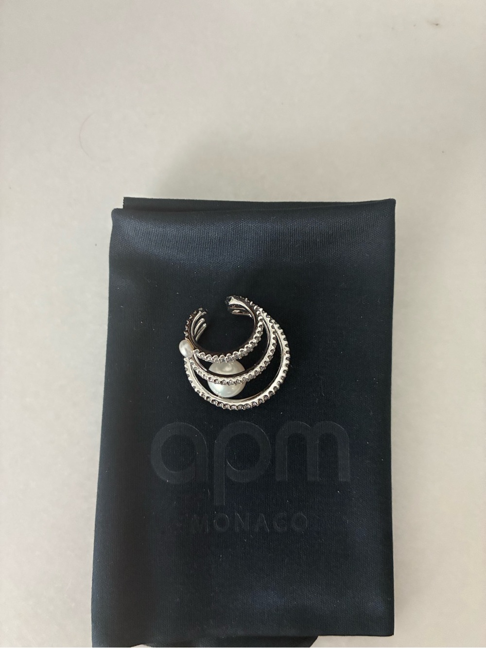 Silver-Tone Pearl Accent Hoop Earring cuff with diamanté on by APM Monaco.
